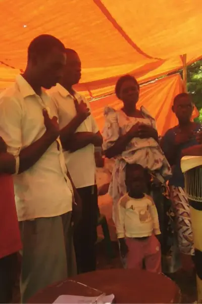 Prayer in the church at AOW Families In Uganda
